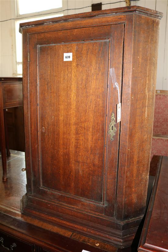 Georgian oak corner cupboard with panelled door(-)